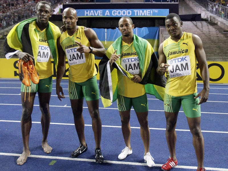FILE - In this Aug. 22, 2009 file photo, Jamaica's sprinters, from left, Usain Bolt, Asafa Powell, Michael Frater and Steve Mullings celebrate winning gold in the Men's 4x100m final during the World Athletics Championships in Berlin, Germany. The Jamaica