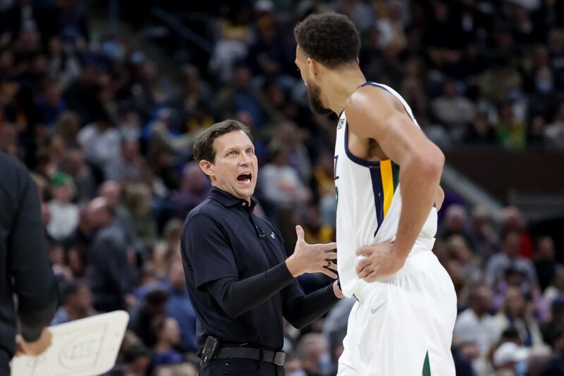 Utah Jazz coach Quin Snyder talks to Rudy Gobert during game against the LA Clippers at Vivint Arena in Salt Lake City.