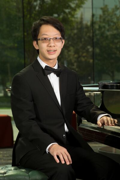 Salute to Youth pianist John Zhao poses for a photo at Abravanel Hall in Salt Lake City on Monday, Aug. 6, 2018. The 16-year-old pianist will perform the first movement from Pyotr Ilyich Tchaikvosky's Piano Concerto No. 1 at the 59th annual Salute to Yout