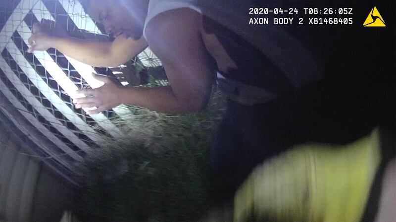 Jeffrey Ryans is seen in police body camera footage recorded Friday, April 24, 2020. Ryans was bit by a police K-9 after he was already kneeling with his hands in the air. The Salt Lake City Police Department is now investigating and an officer has been placed on leave.