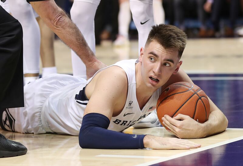 Brigham Young Cougars guard Zac Seljaas (2) hits the floor with the ball in Provo on Thursday, Feb. 21, 2019. BYU lost 77-71.