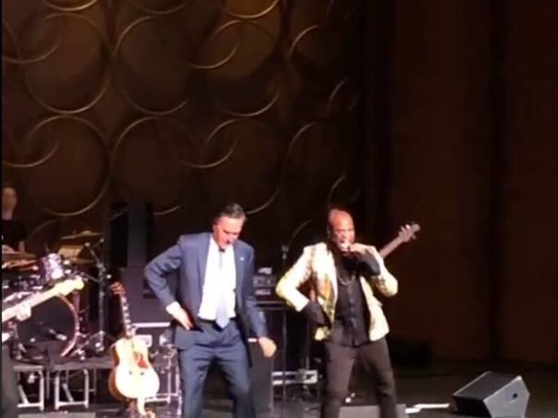 Mitt Romney, left, on stage with Mormon artist Alex Boye.