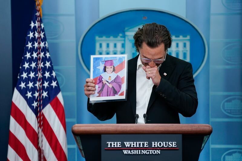 Actor Matthew McConaughey holds an image of Alithia Ramirez, 10, who was killed in the mass shooting at an elementary school in Uvalde, Texas, as he speaks during a press briefing at the White House