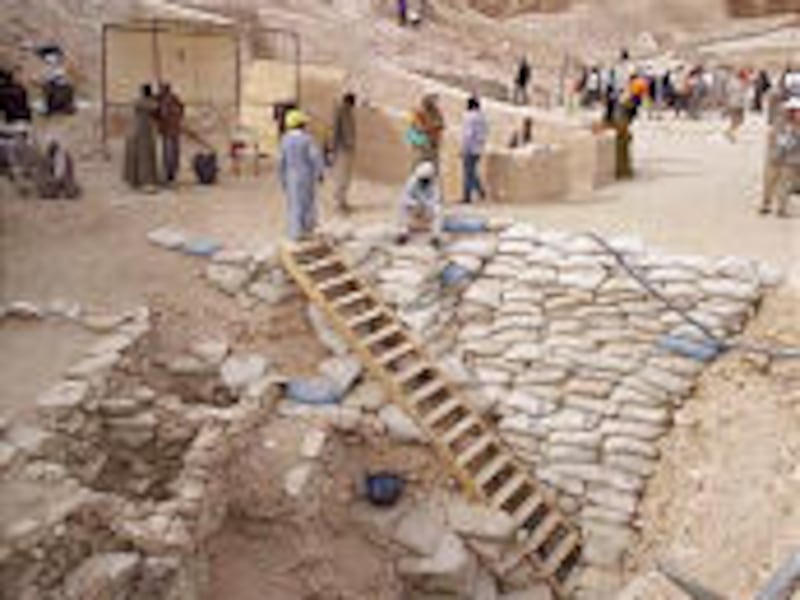 Archaeologists work at a shaft leading to a tomb discovered in Egypt's Valley of the Kings, outside Luxor, on Wednesday.