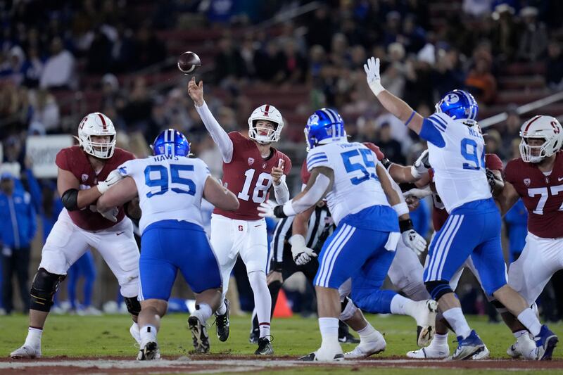 Stanford quarterback Tanner McKee (18) throws a pass against BYU during the first half of an NCAA college football game in Stanford, Calif., Saturday, Nov. 26, 2022.