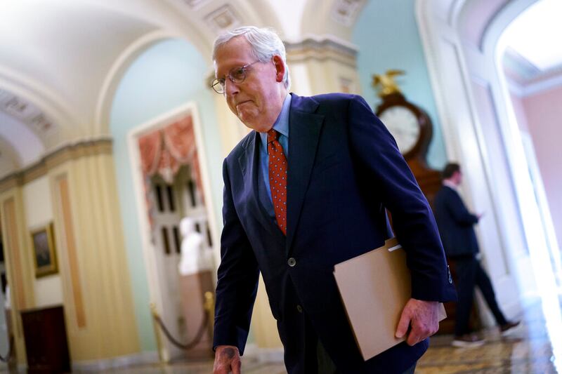 Senate Minority Leader Mitch McConnell, R-Ky., walks to the chamber at the Capitol in Washington.