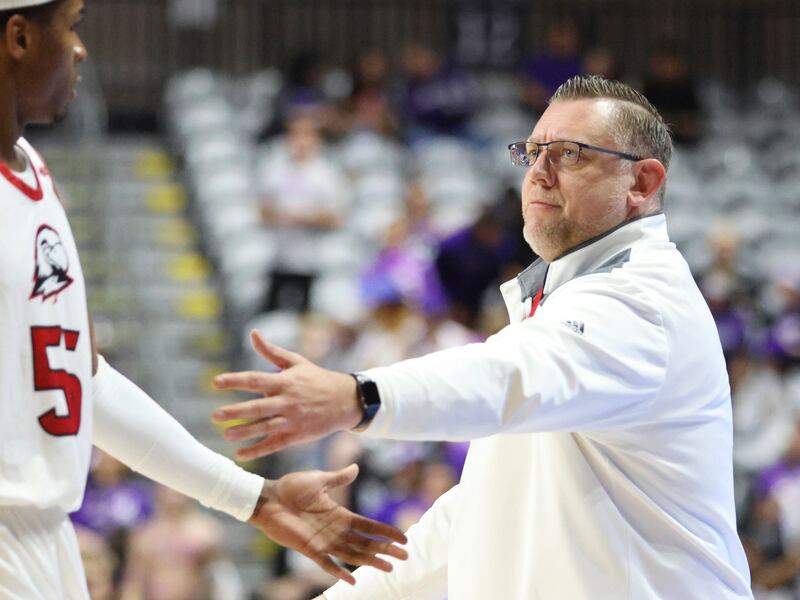 Southern Utah head coach Todd Simon greets Tevian Jones (55) at the bench during the first half of an NCAA college basketball game against Grand Canyon in the championship of the Western Athletic Conference tournament Saturday, March 11, 2023, in Las Vegas. Grand Canyon won 84-66. (AP Photo/Ronda Churchill)