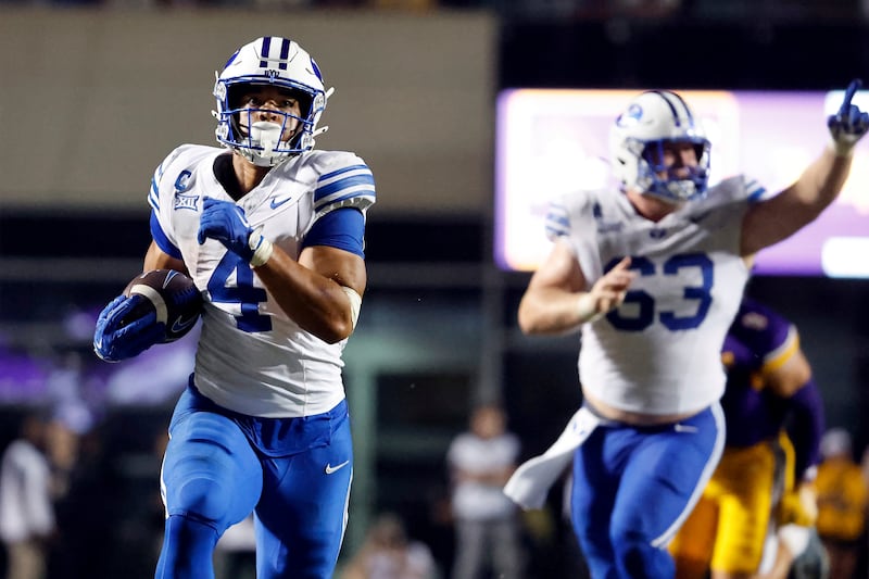 BYU running back LJ Martin (4) runs for a touchdown against East Carolina during game in Greenville, N.C., Saturday, Sept. 20, 2025.