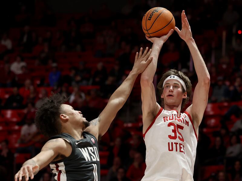 Utah center Branden Carlson gets off a shot against Washington State forward DJ Rodman at the Huntsman Center.