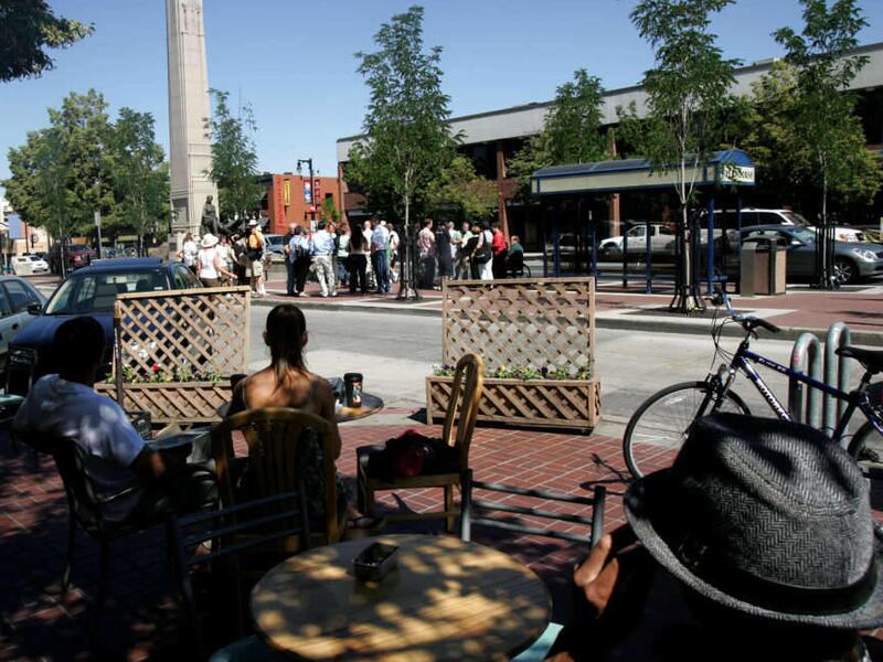 In this 2007 file photo, Harry Mantle sits at the Sugar House Coffee Shop while Rocky Anderson speaks about the redevelopment of Sugar House. Construction began Monday on the new Sugar House Monument Plaza on the corner of 2100 South and Highland Drive.