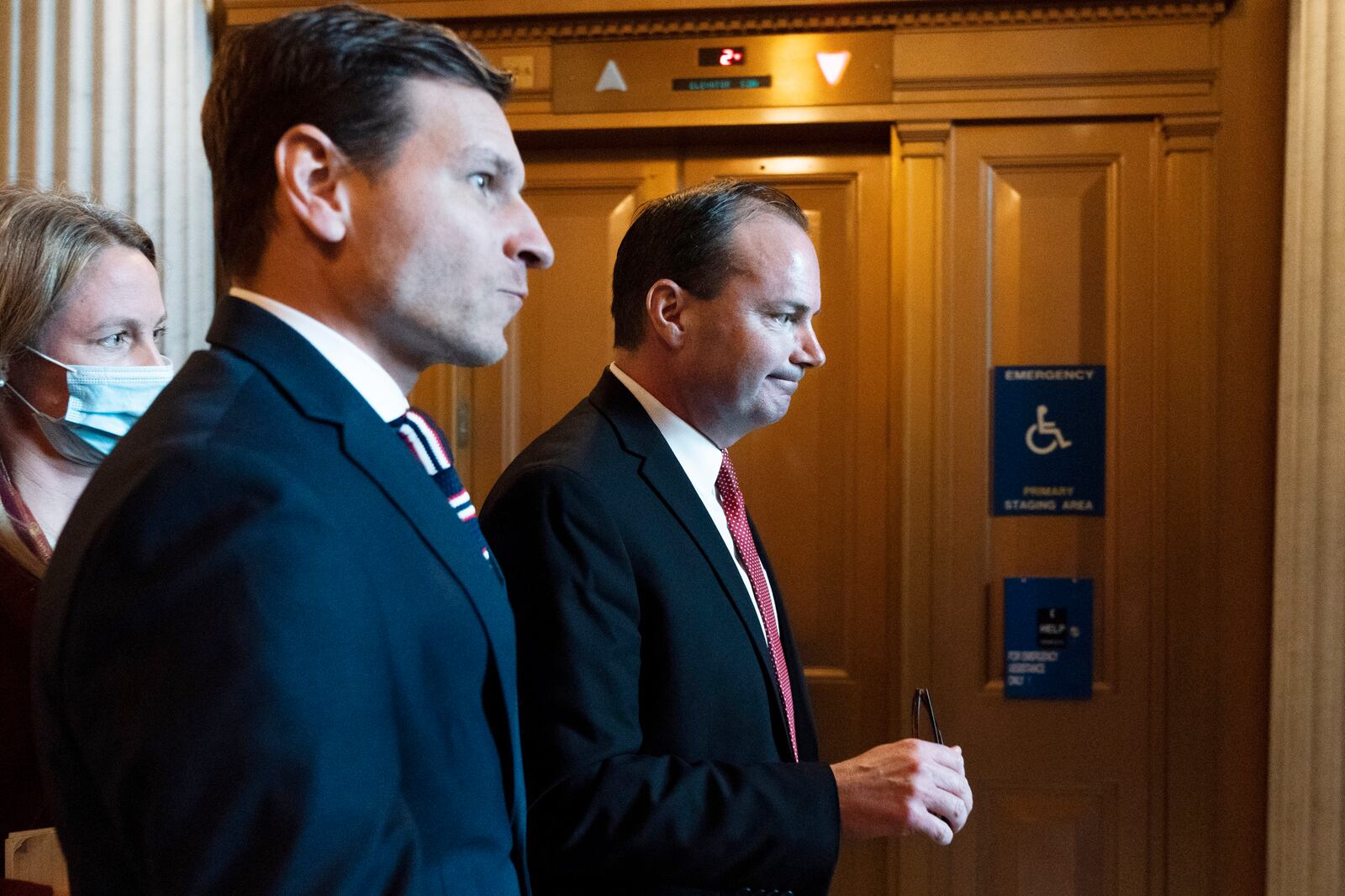 Sen. Mike Lee, R-Utah, walks to a luncheon for Senate Republican on Capitol Hill in Washington.