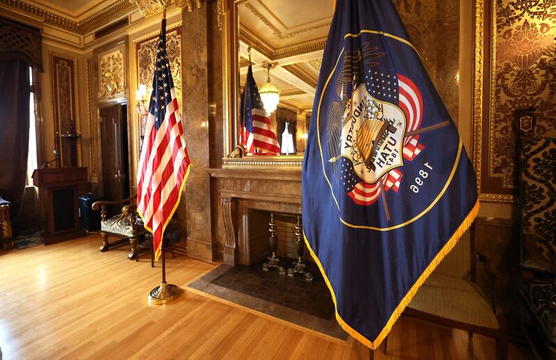 The American flag and the Utah flag in the Gold Room of the Utah Capitol.