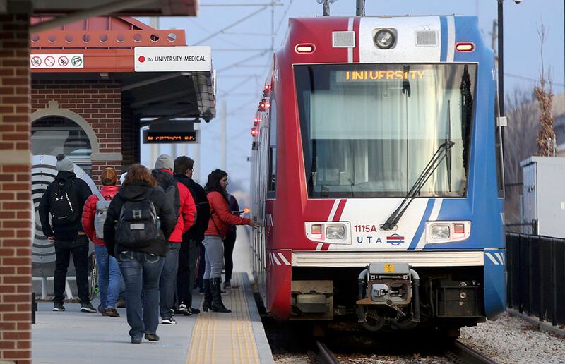 FILE - People board a red line train at the Bingham Junction Trax Station in Midvale on Friday, Jan. 5, 2018. An analysis ordered by the Point of the Mountain Development Commission details ways that $2.5 billion in funding could be secured to accelerate,