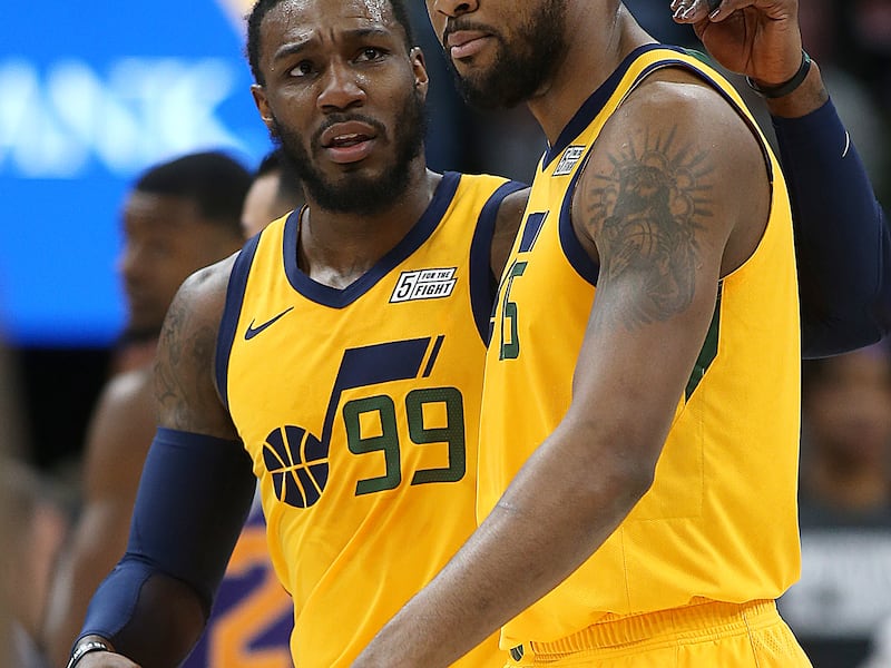 Utah Jazz forward Jae Crowder (99) and Utah Jazz forward Derrick Favors (15) talks during a timeout as the Utah Jazz and the Phoenix Suns play in an NBA basketball game at Vivint Smart Home Arena in Salt Lake City on Wednesday, Feb. 6, 2019.