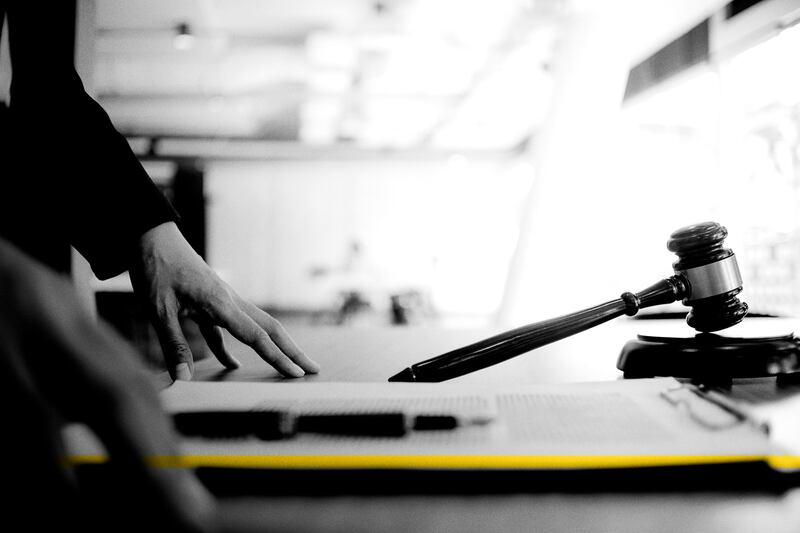 A judge’s gavel sits on a judge’s desk.