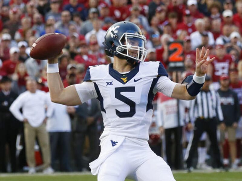 West Virginia quarterback Chris Chugunov (5) passes in the second quarter of an NCAA college football game against Oklahoma in Norman, Okla., Saturday, Nov. 25, 2017.