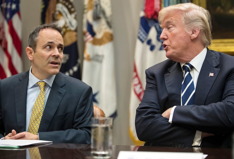 FILE - In this Thursday, Jan. 11, 2018, file photo, President Donald Trump, right, and Kentucky Gov. Matt Bevin, left, talk during a prison reform roundtable in the Roosevelt Room of the Washington. Kentucky has become the first state to win approval from