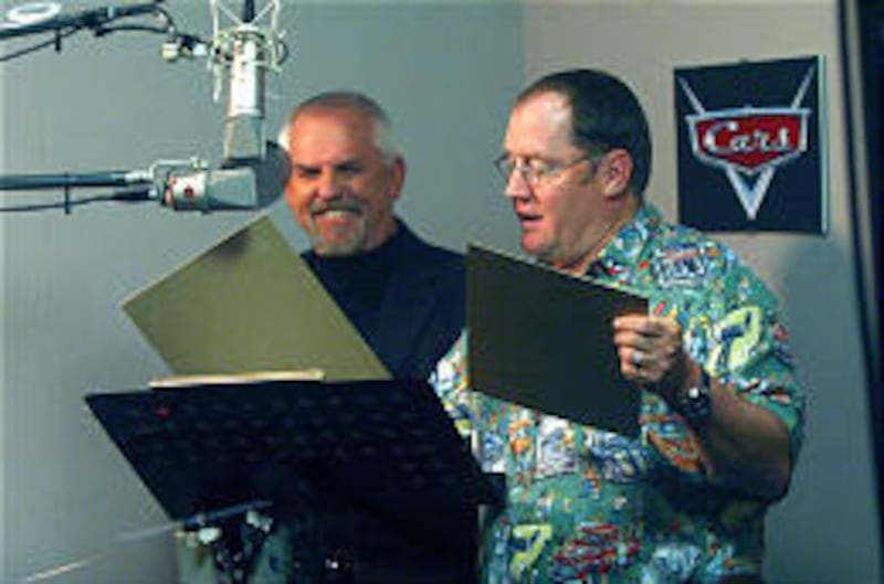 Actor John Ratzenberger, left, takes direction from John Lasseter during voice recording for "Cars."