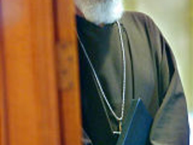 Archbishop Sean O'Malley prepares to release a closure list at a news conference Tuesday.