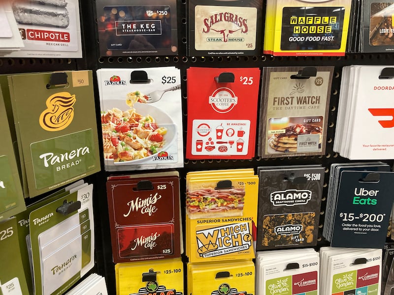 Gift cards are displayed on a rack in a grocery store in southeast Denver.