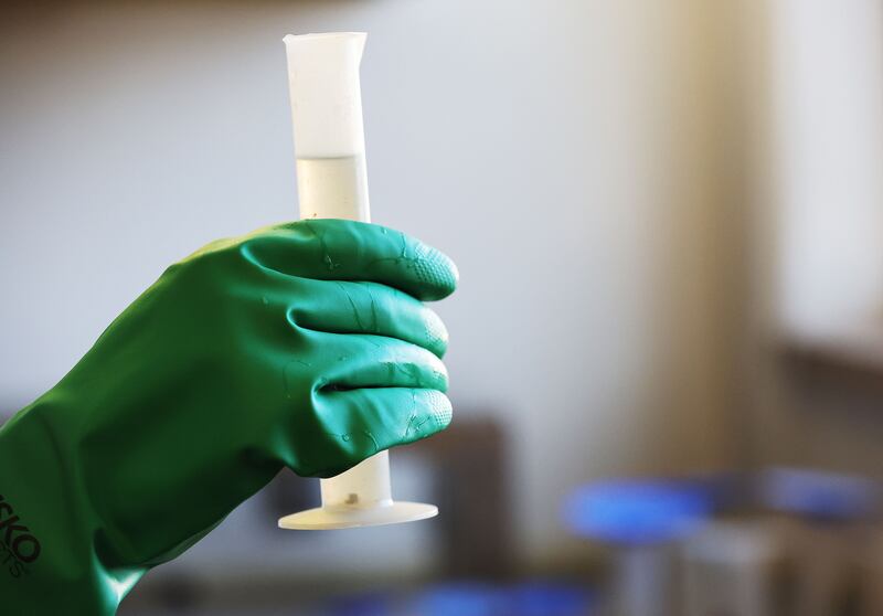 Benjamin Jordan tests a wastewater sample for COVID-19 at Salt Lake City Water Reclamation Facility on April 6, 2022.