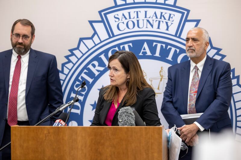 Utah County Attorney David Leavitt, left, and Salt Lake County District Attorney Sim Gill, right, listen as Summit County Attorney Margaret Olson discusses the death penalty in Utah at the Salt Lake County District Attorney’s Office building in Salt Lake City on Tuesday, Sept. 14, 2021, as Utah County Attorney David Leavitt looks on.