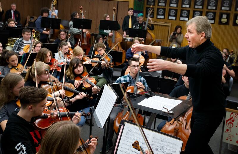 Thierry Fischer, music director of the Utah Symphony, directs the Cottonwood High School orchestra in Murray on Thursday, March 14, 2019. Fischer will lead the Utah Symphony in performances of Antonin Dvorak's "New World" symphony at Abravanel Hall March