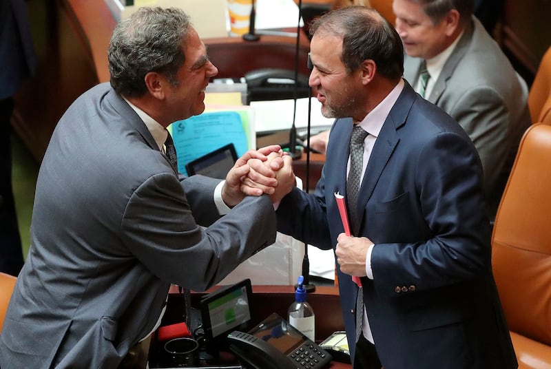 Utah House Minority Leader Brian King, D-Salt Lake City, shakes hands House Majority Leader Mike Schultz, R-Hooper.
