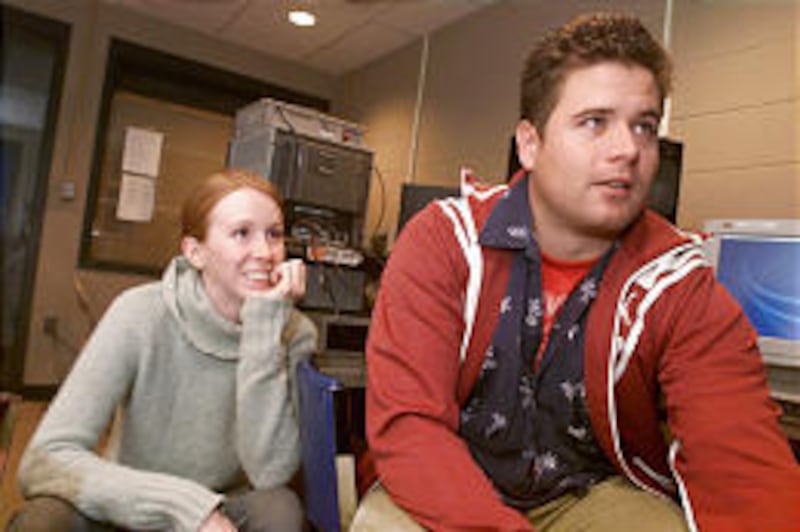 MSU students Sara Slagle and John Shier edit video Shier shot of grizzly bears. Shier recently won the Michael Brinkman Emerging Filmmaker Award for his efforts.