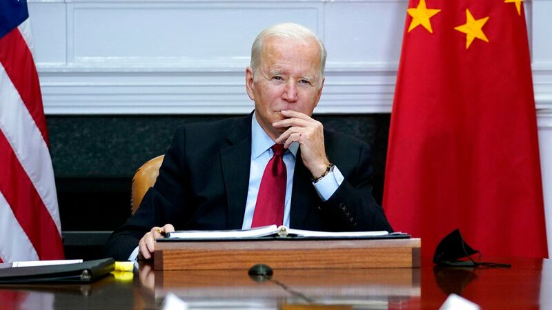 President Joe Biden listens in meeting with Chinese President Xi Jinping.