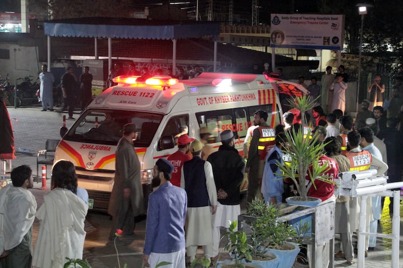 Rescue workers unload earthquake victims from an ambulance at a hospital in Saidu Sharif, a town Pakistan’s Swat valley.