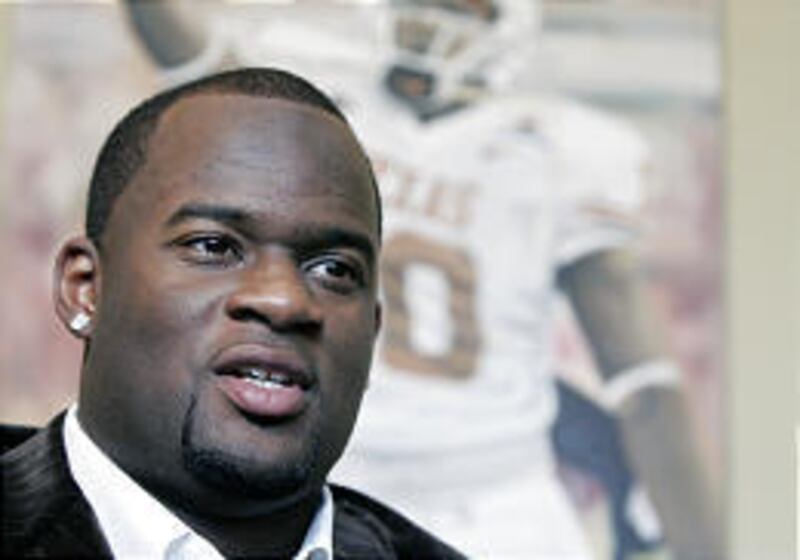 Tennessee QB Vince Young speaks at a press conference in Houston. Young was named AP Offensive Rookie of Year on Wednesday.