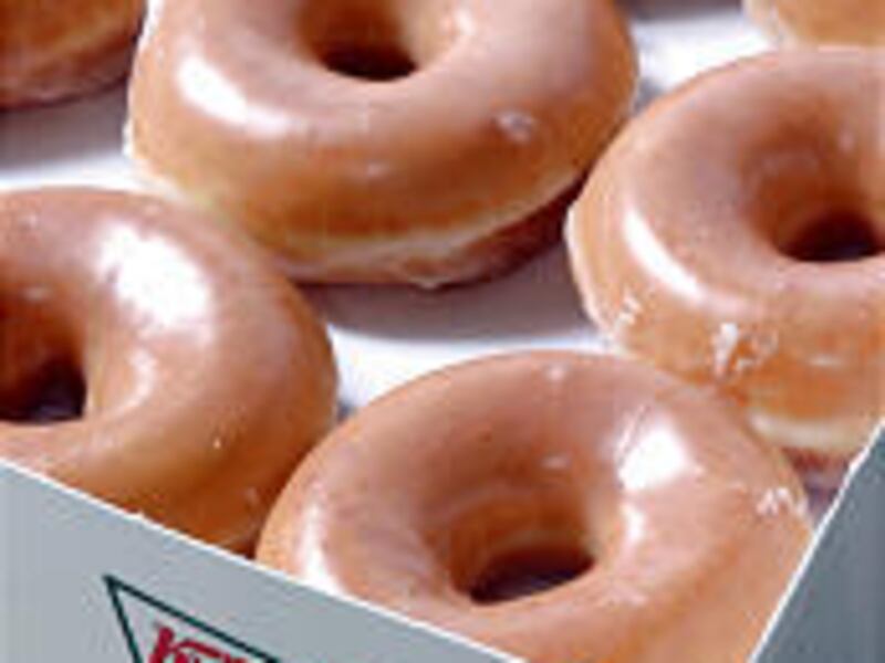 A dozen Krispy Kreme doughnuts.