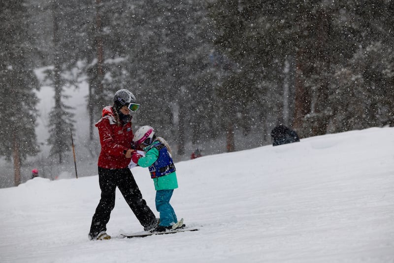 Peer instructor Sydney Tyler gives ski lessons to a child at Brighton Resort in Big Cottonwood Canyon on Jan. 20, 2024.