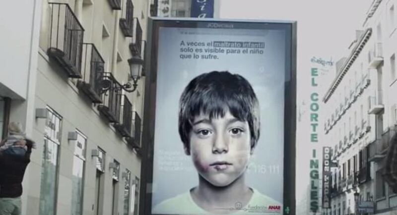A Spanish foundation is using what Resource Magazine calls "the lenticular forces of good" to share a secret message with child abuse victims in public service announcements around Spain.