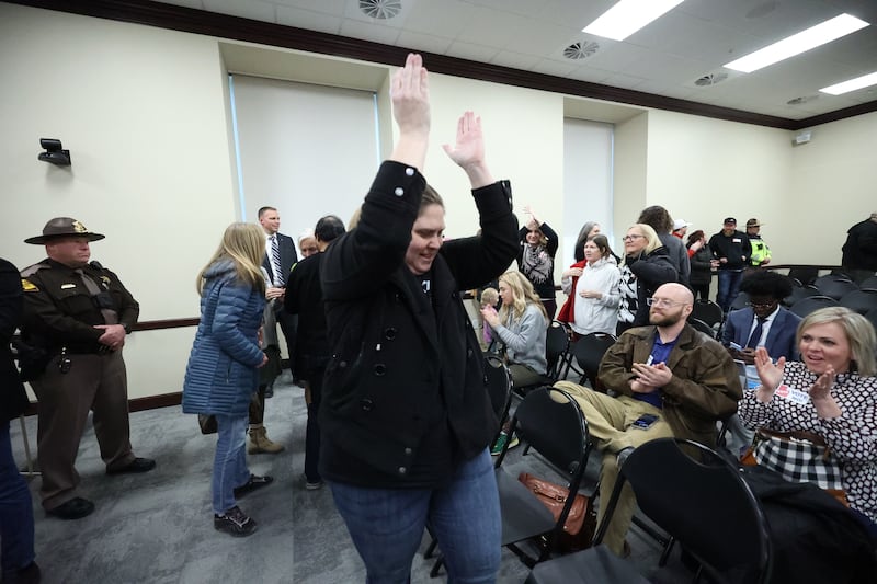 Crowd members cheer after SB88 was held after residents showed up to express feelings.