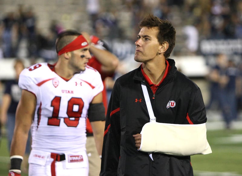 Utah Utes quarterback Jordan Wynn (3) walks off the field at the end of the game as the University of Utah football team is defeated by Utah State University 27-20 in overtime Friday, Sept. 7, 2012,in Logan, Utah.