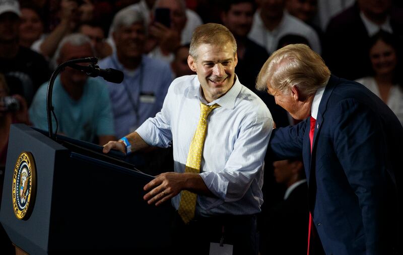 Rep. Jim Jordan, R-Ohio, looks to then-President Donald Trump at a rally in Lewis Center, Ohio, on Aug. 4, 2018.