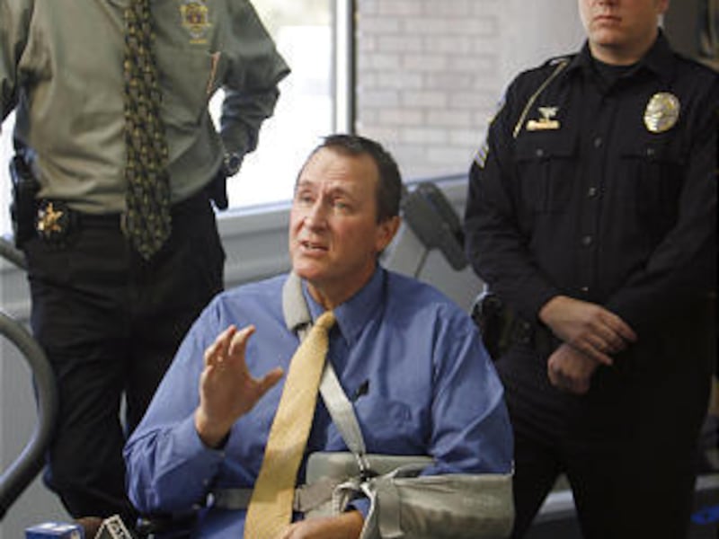 Utah Attorney General Mark Shurtleff, center, with T.J. Harper, left, and Greg Severson, speaks to media in Orem Wednesday.