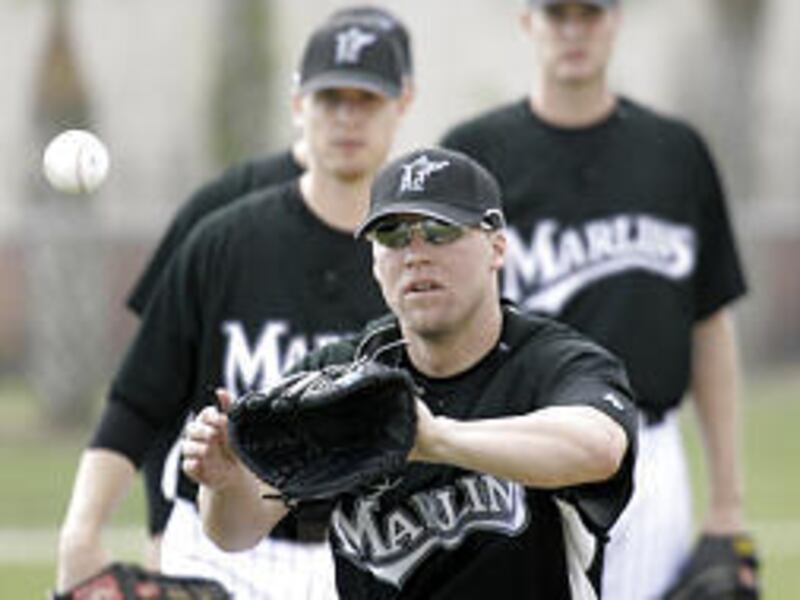 Florida Marlins pitcher Matt Lindstrom catches a ball during spring training Tuesday afternoon.