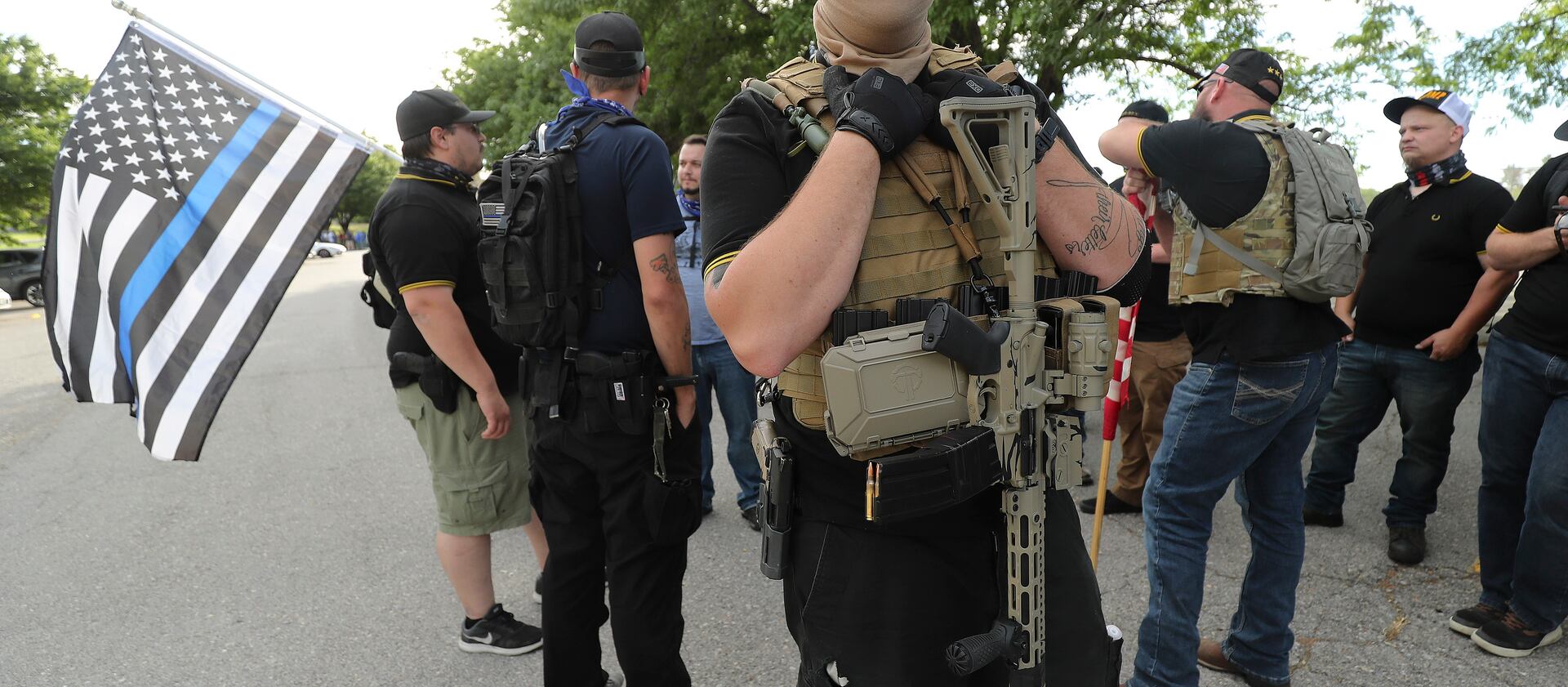 A member of Utah Citizens’ Alarm who did not give his name gathers with others at Valley Regional Park in Taylorsville.