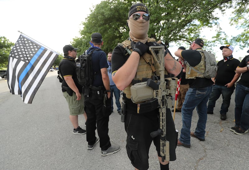 A member of Utah Citizens’ Alarm who did not give his name gathers with others at Valley Regional Park in Taylorsville.
