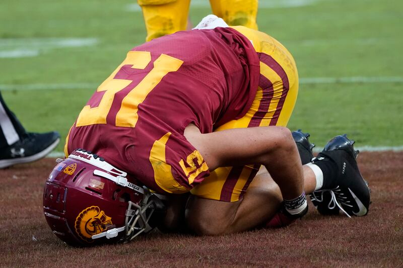 Southern California wide receiver Drake London goes down with an injury in the end zone after scoring a touchdown.