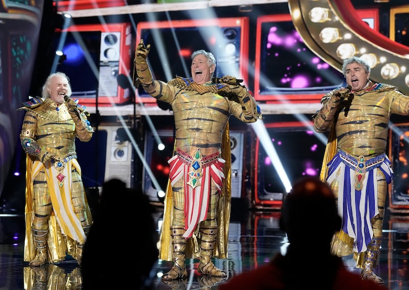Mike Lookinland, Barry Williams and Christopher Night on “The Masked Singer.”
