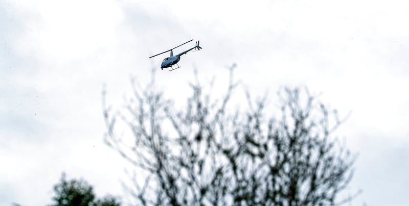 A helicopter aids the FBI and police and sheriff’s departments in North Port, Fla., as they search for Brian Laundrie.