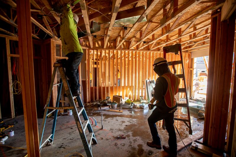 FILE - Construction workers work at the Garden Lofts, an affordable housing project being built in Salt Lake City, on Friday, Dec. 28, 2018. In effort to encourage affordable housing amid Utah's housing crisis, a Utah lawmaker is pushing a bill that would