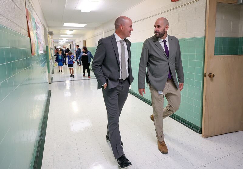Utah Gov. Spencer Cox talks with Magna Elementary School principal Benjamin Peters while visiting Magna Elementary School in Magna on Friday.