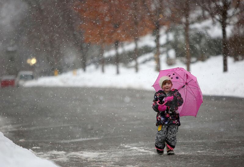 Theda Pinette, 2, walks through Memory Grove Park during a snow storm in Salt Lake City on Monday, Jan. 23, 2017.