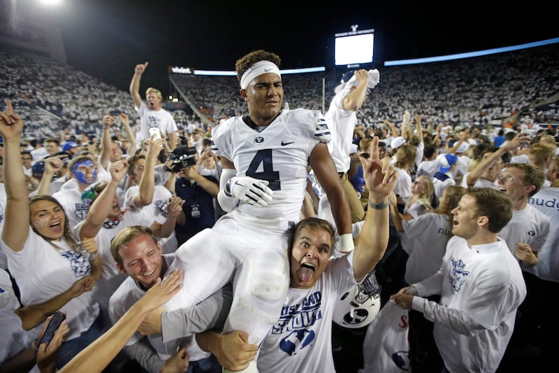 BYU fans carry Fred Warner following the Cougars’ victory against Boise State, in Provo on Sept. 12, 2015. Warner now stars for the San Francisco 49ers.