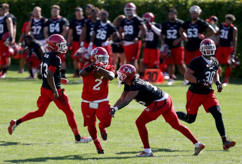 Utah's Zack Moss (2) runs the ball during practice at Eccles Football Center at the University of Utah in Salt Lake City on Friday, July 28, 2017.
